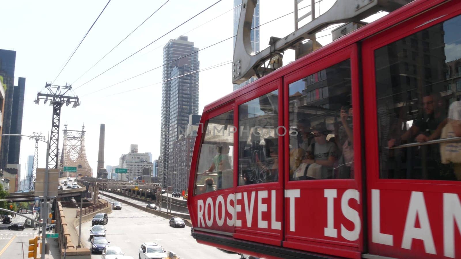 New York City, United States - 4 Sept 2023: Roosevelt Island tramway to Manhattan Midtown streets. American cable tram, Queensboro Bridge. Urban public transport, USA. Building architecture cityscape.