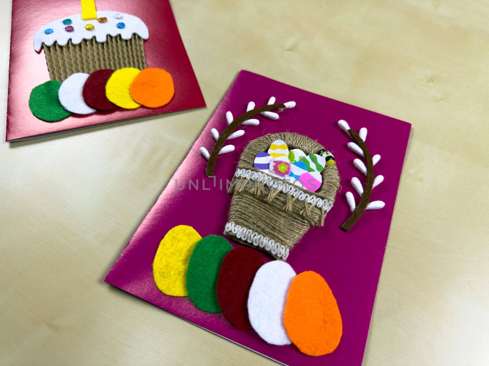 This vibrant handmade Easter card features charming woven basket filled with colorful felt eggs and delightful decorations. Perfect for sending festive greetings and adding joy to Easter celebrations