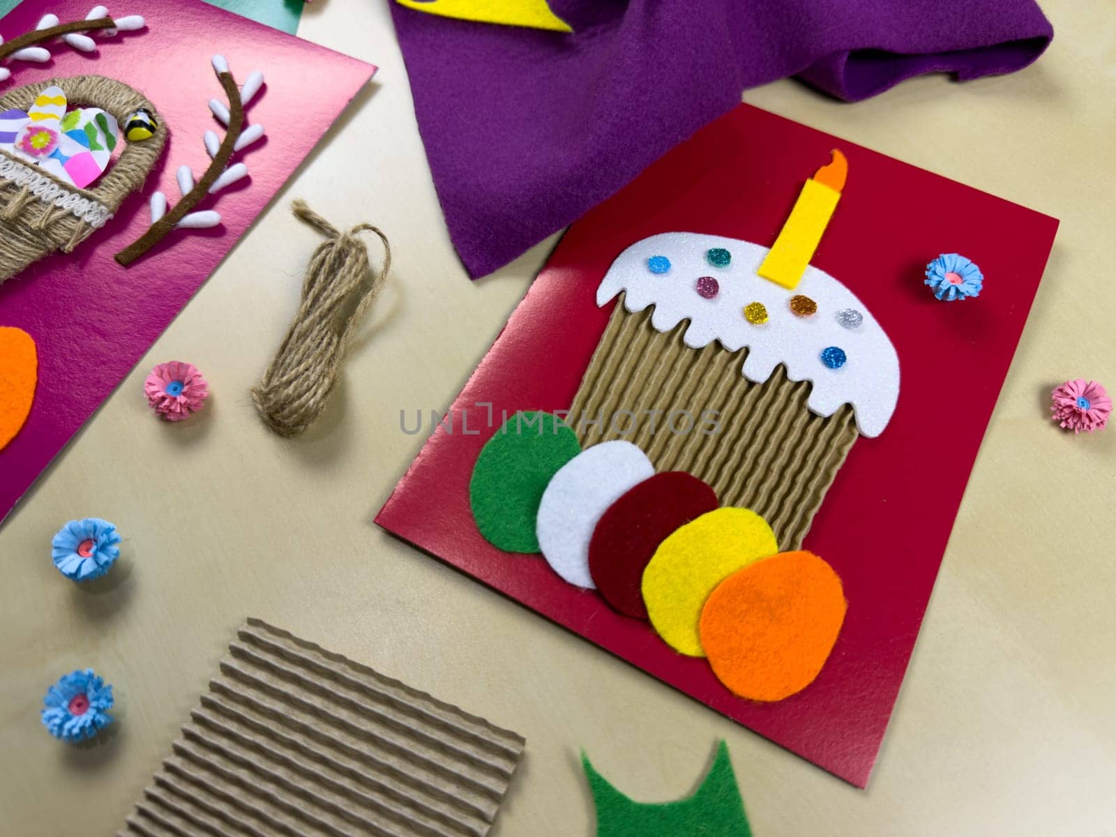 Creative process of making vibrant Easter cards featuring felt, yarn, and decorative elements. Ideal materials for crafting unique cards that capture the spirit of spring festivities