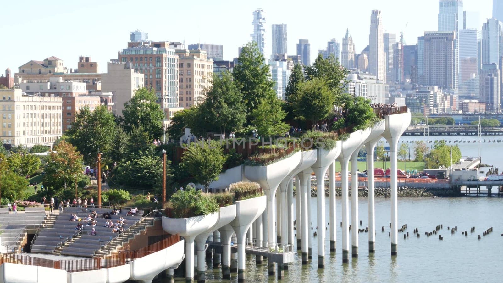 New York City, United States - 1 Sept 2023: Little Island park. Manhattan downtown Financial District skyline cityscape. American urban buildings architecture. World Trade Center skyscraper, USA.