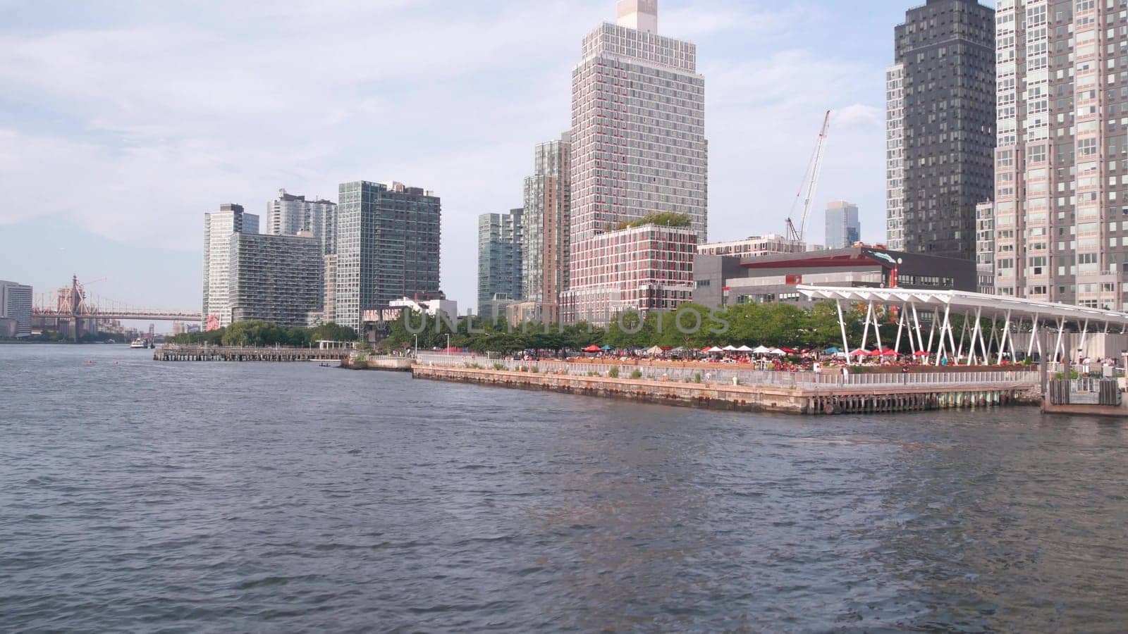 New York City, United States - 31 Aug 2023: Long Island skyline, Hunters Point pier, ferry boat. Highrise skyscrapers from ferryboat. East river waterfront panorama, riverfront buildings architecture.