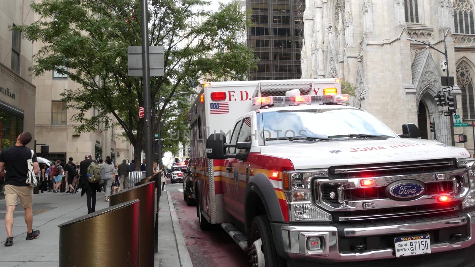 New York City, United States - 13 Sept 2023: NYFD Ambulance medical emergency, american fire department paramedic truck siren, Manhattan 5 fifth avenue. USA 911 vehicle on street. NYC first responders