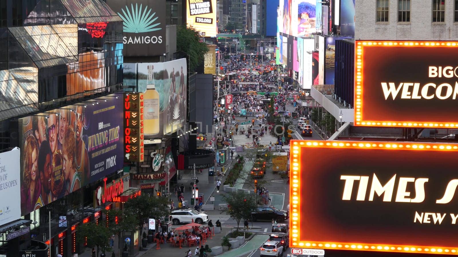 New York City, United States - 14 Sept 2023: Times Square, Manhattan Midtown Broadway street, USA. American NYC urban road traffic, people from above. Commercial illuminated billboard screens glowing.
