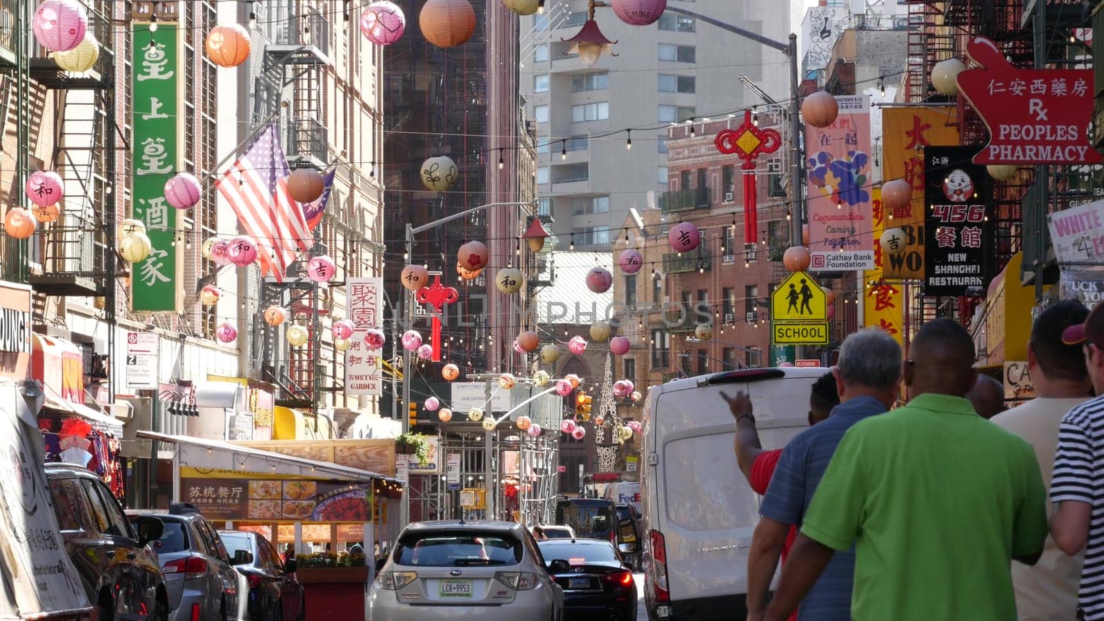 New York City, United States - 14 Sept 2023: Manhattan Chinatown Mott street, chinese ethnic district buildings architecture, USA. Red round paper lanterns, people and hieroglyph signs. Little China.