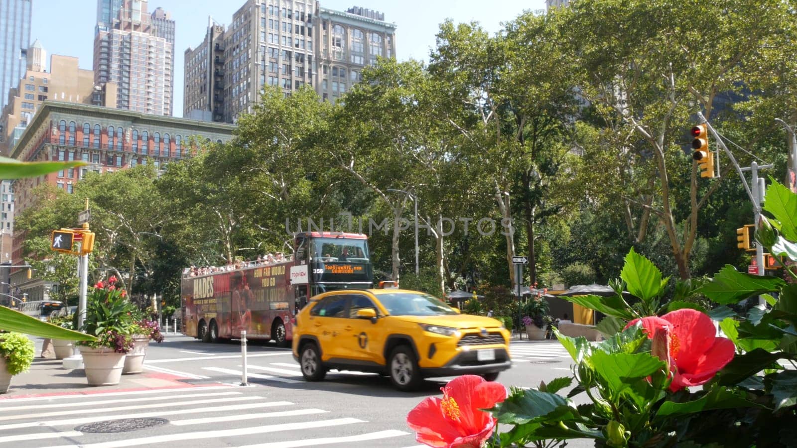 New York City, United States - 6 Sept 2023: Manhattan Midtown Broadway, 23 street, 5 avenue crossroad intersection. Worth Square near Madison Park and Flatiron Building, USA. People. Yellow taxi car