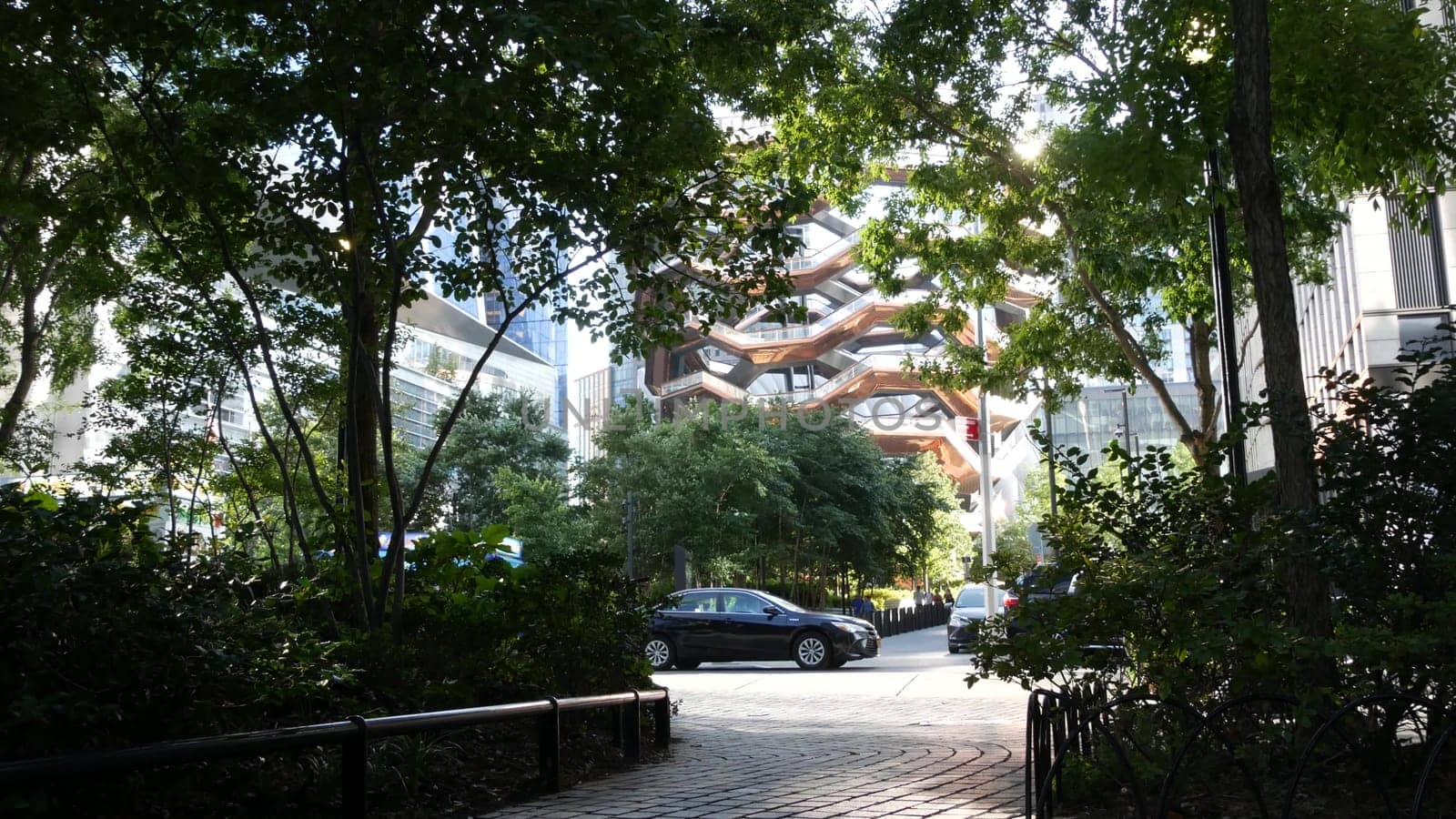 New York City, United States - 1 Sept 2023: Hudson Yards Vessel, urban architecture in Chelsea, Manhattan Midtown 34 street, USA. New modern glass skyscrapers, american business buildings, real estate