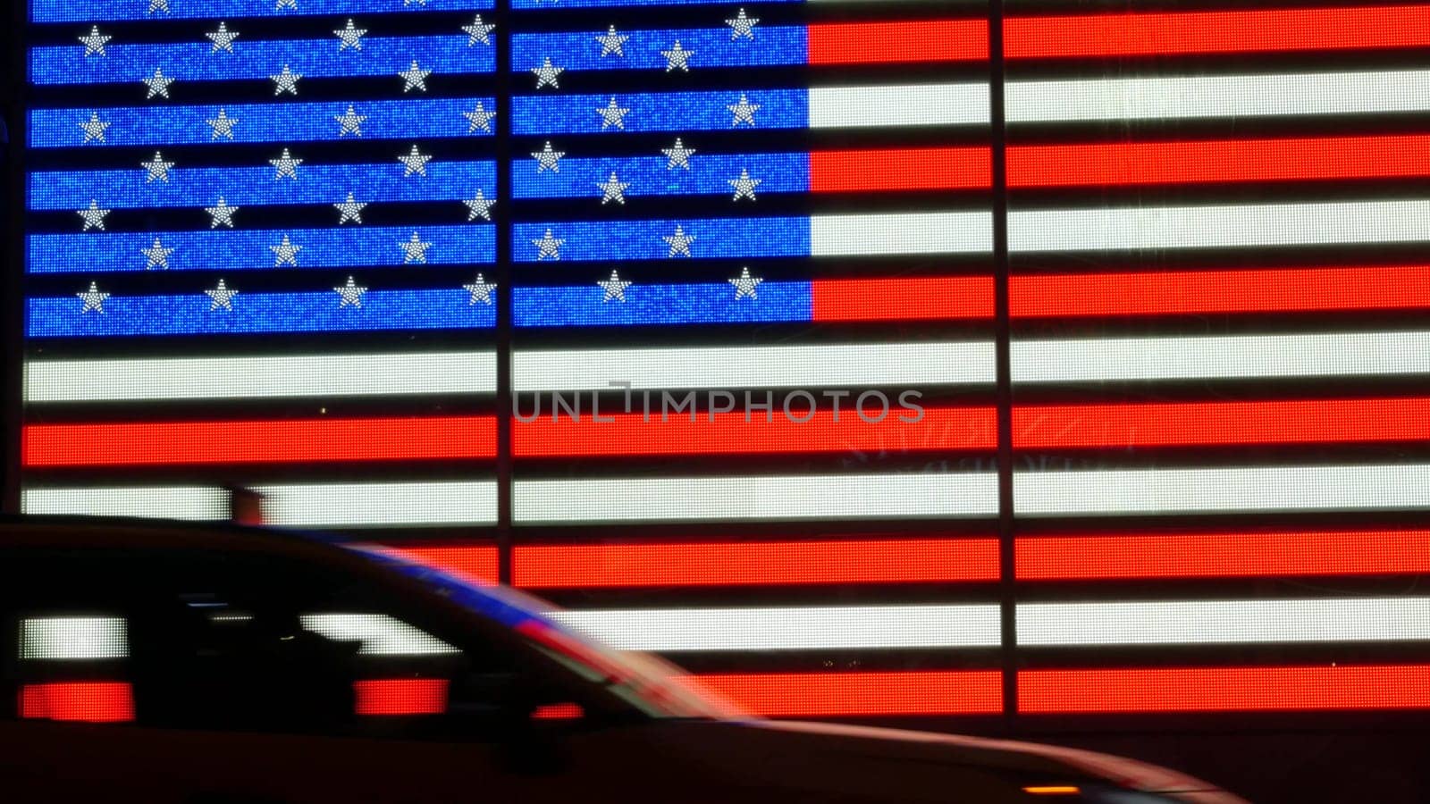 New York City, United States - 5 Sept 2023: Times Square, Manhattan Midtown Broadway street, USA. American flag, NYC urban life. Military island, army recruiting office. People silhouettes, car shadow