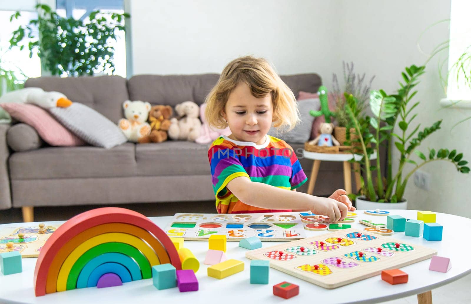 Child learns numbers and letters. Selective focus. Kid.