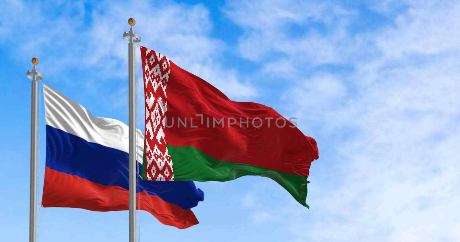 Photorealistic 3D render of Belarus and Russia flags waving side by side under a clear sky. Perfect for diplomacy, partnership and international relations themes