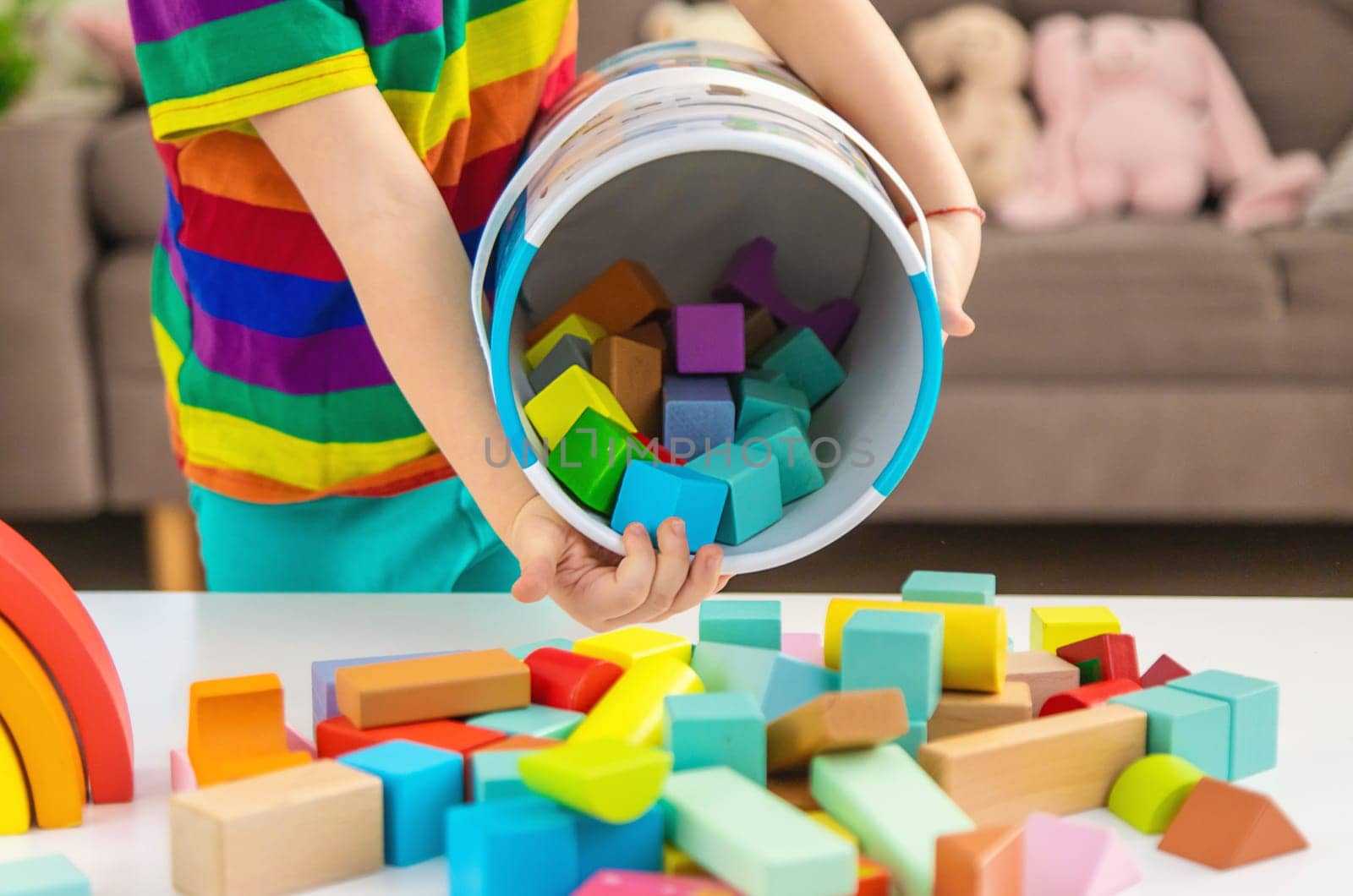 A child builds from blocks. Selective focus. kid.
