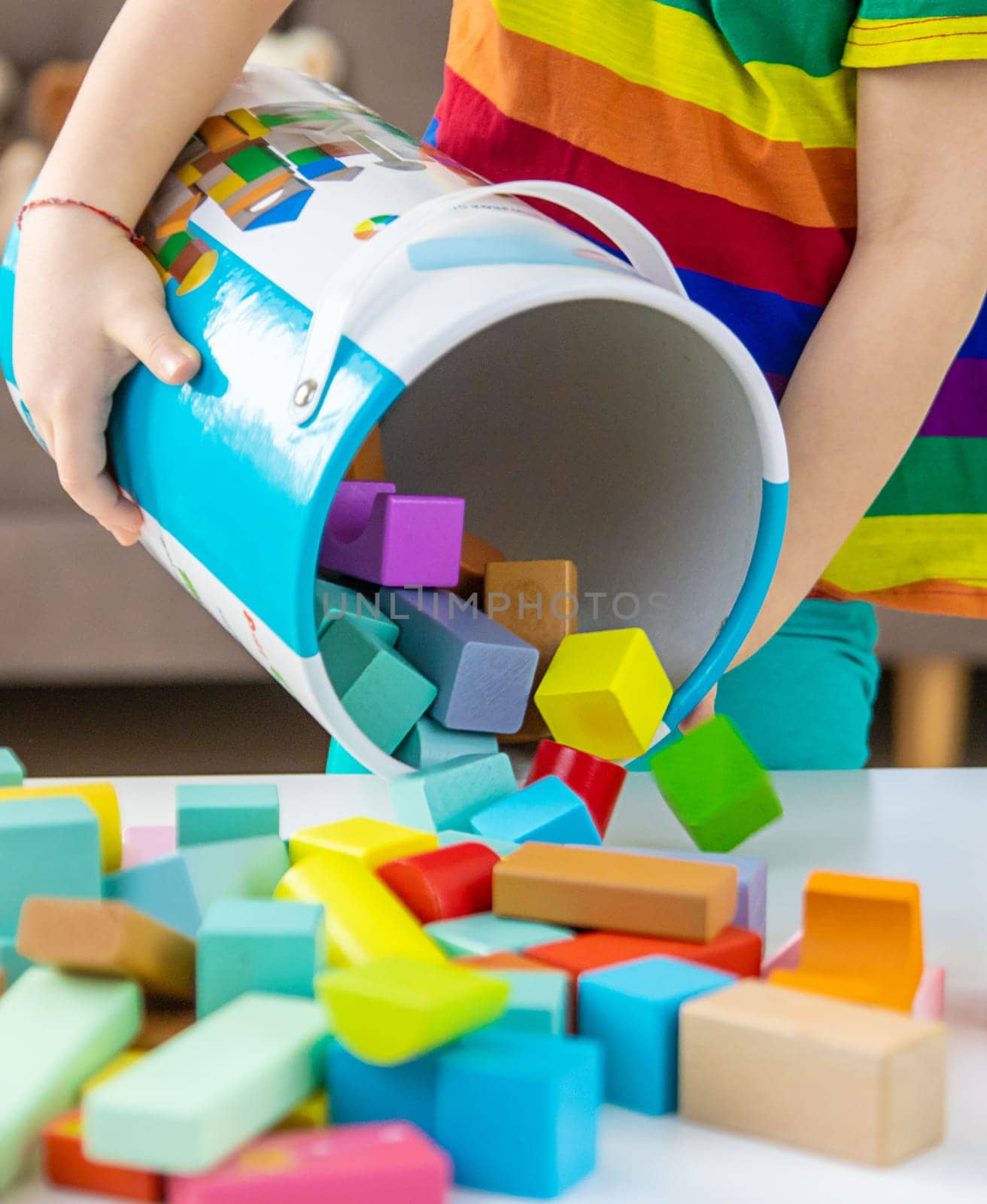 A child builds from blocks. Selective focus. kid.