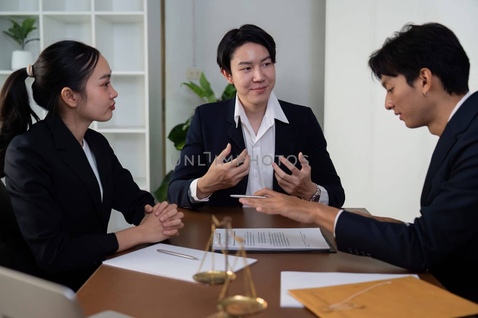 Lawyers collaborate on a legal case, highlighting the importance of teamwork and strategic planning to achieve the desired outcome.