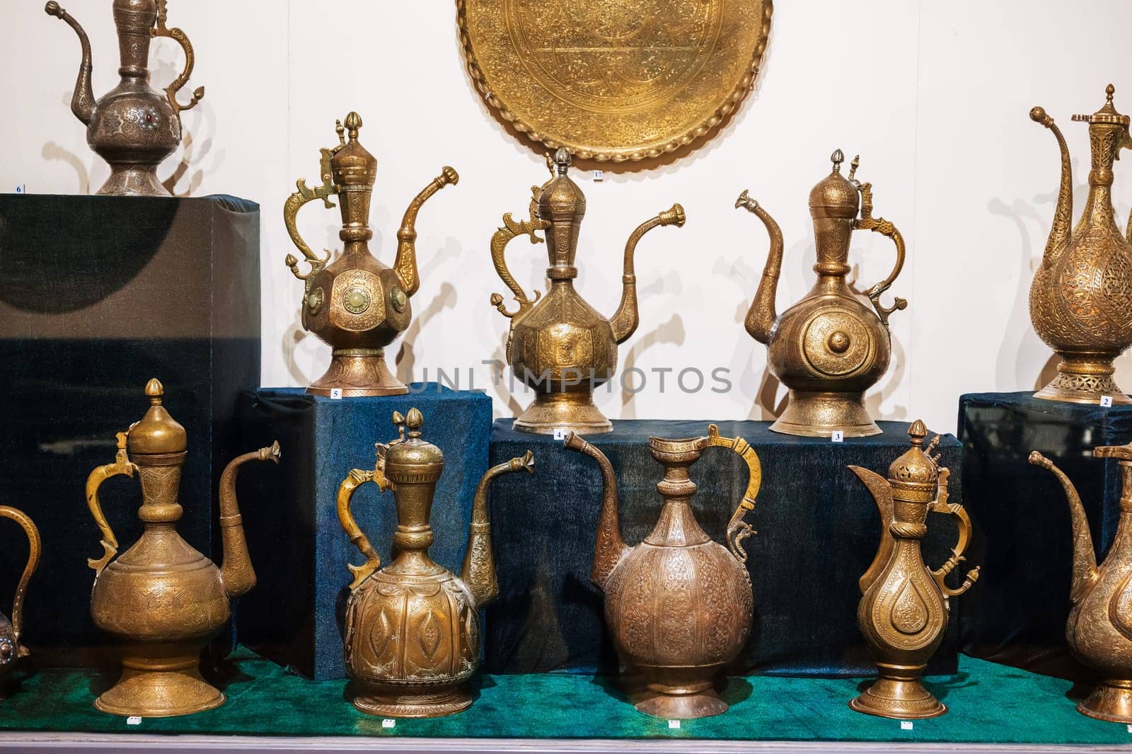 antique traditional Uzbek copper and brass jugs on exhibition at the Museum of Antiques in Tashkent in Uzbekistan