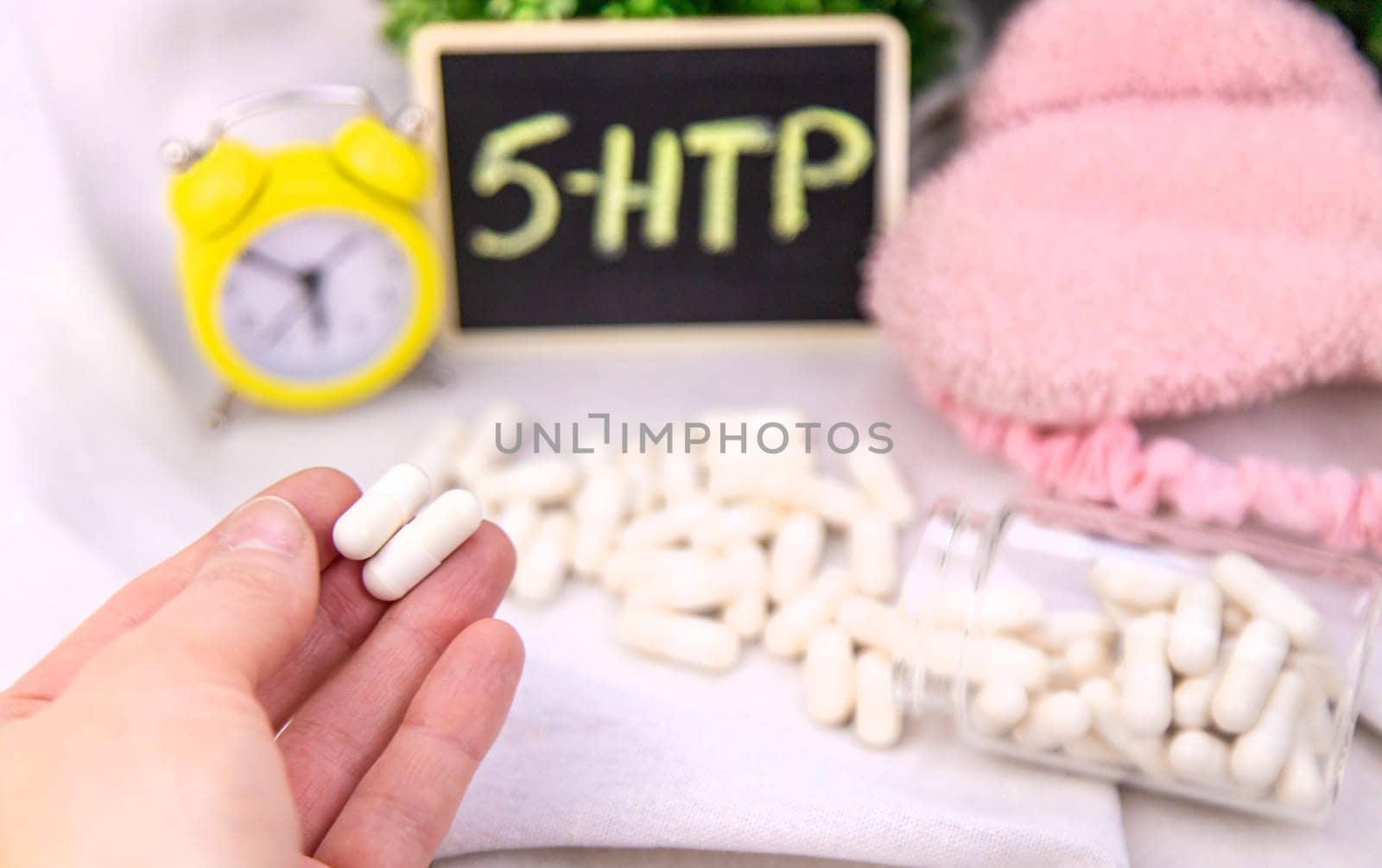 5-HTP sleep supplement capsules. Selective Focus. night.