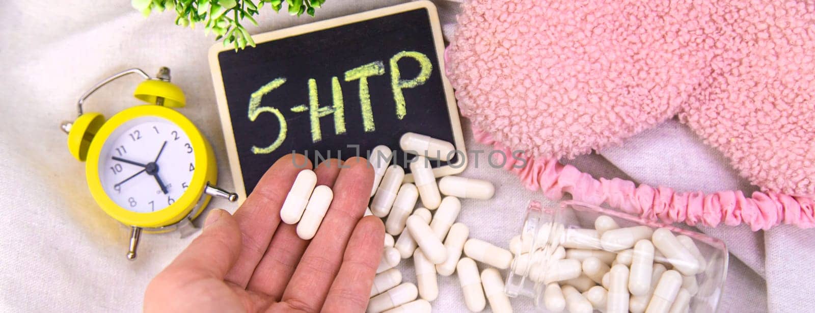 5-HTP sleep supplement capsules. Selective Focus. night.