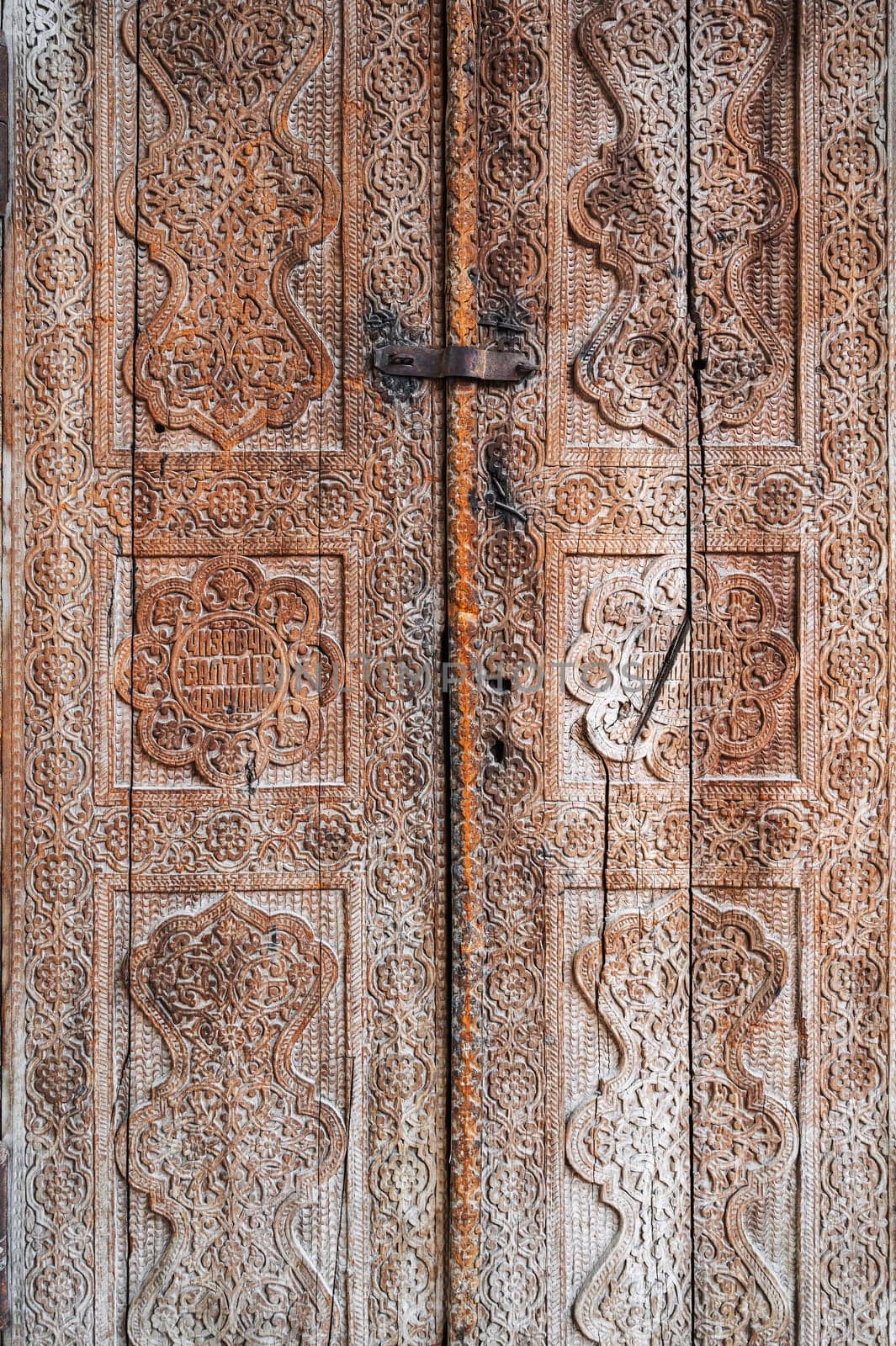 traditional Uzbek carved pattern on vintage wooden door in Tashkent in Uzbekistan