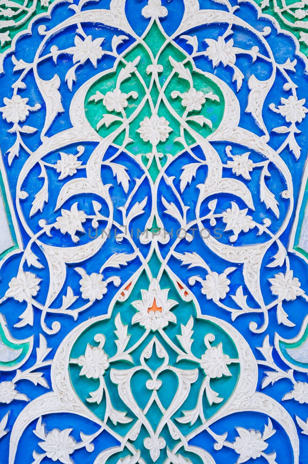 colorful carved wooden painted background with traditional Uzbek ornaments and oriental patterns in Tashkent in Uzbekistan