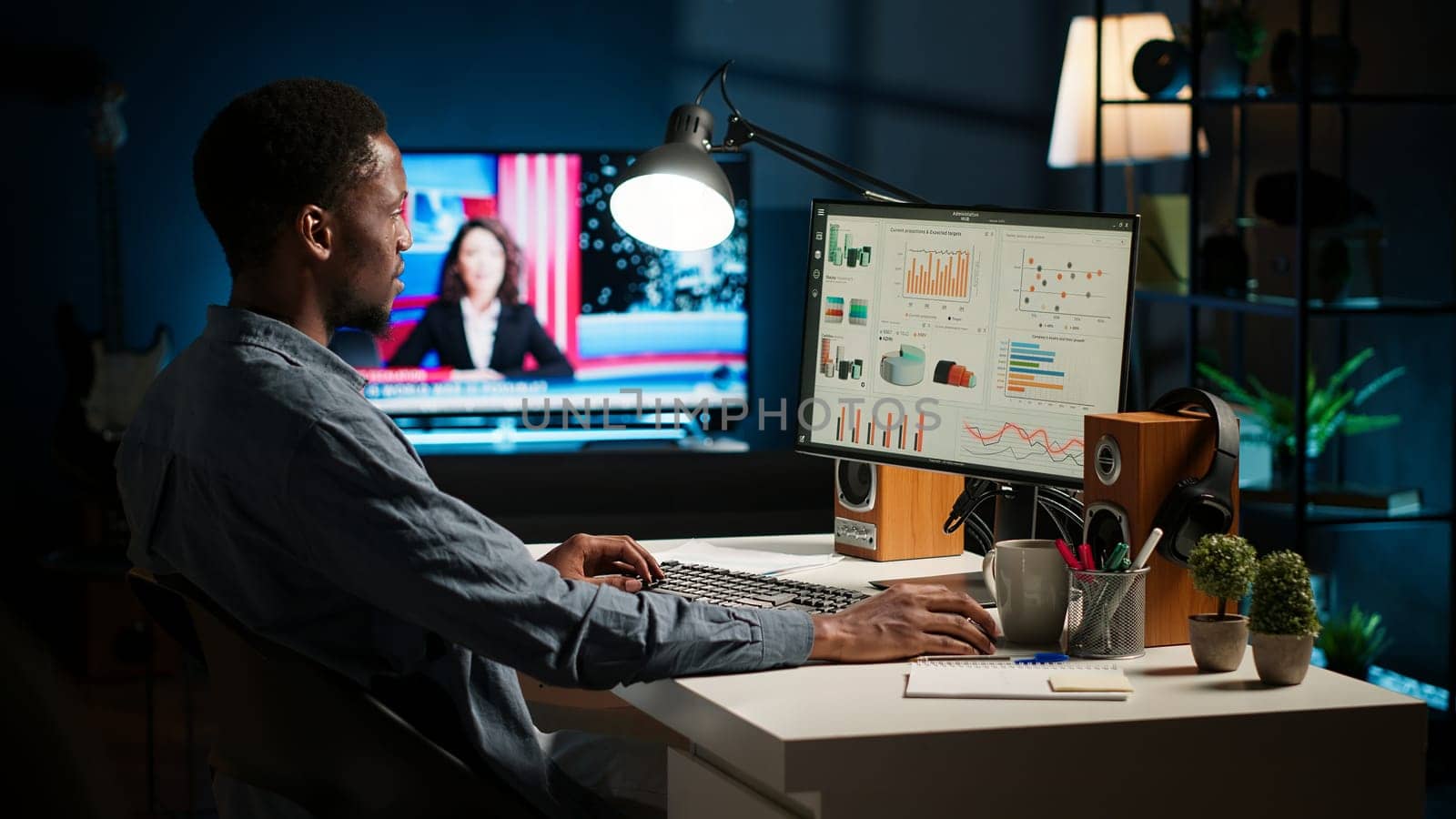 Network analyst studying digital commerce progression reports on computer, working at home to boost earnings and gain shareholder backing. Specialist analyzes company information. Camera A.