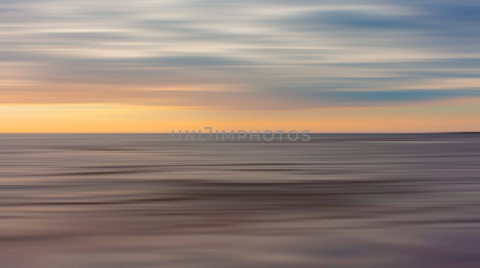 Abstract view of the sea and clouds in motion blur style . Pastel, dreamy scene.