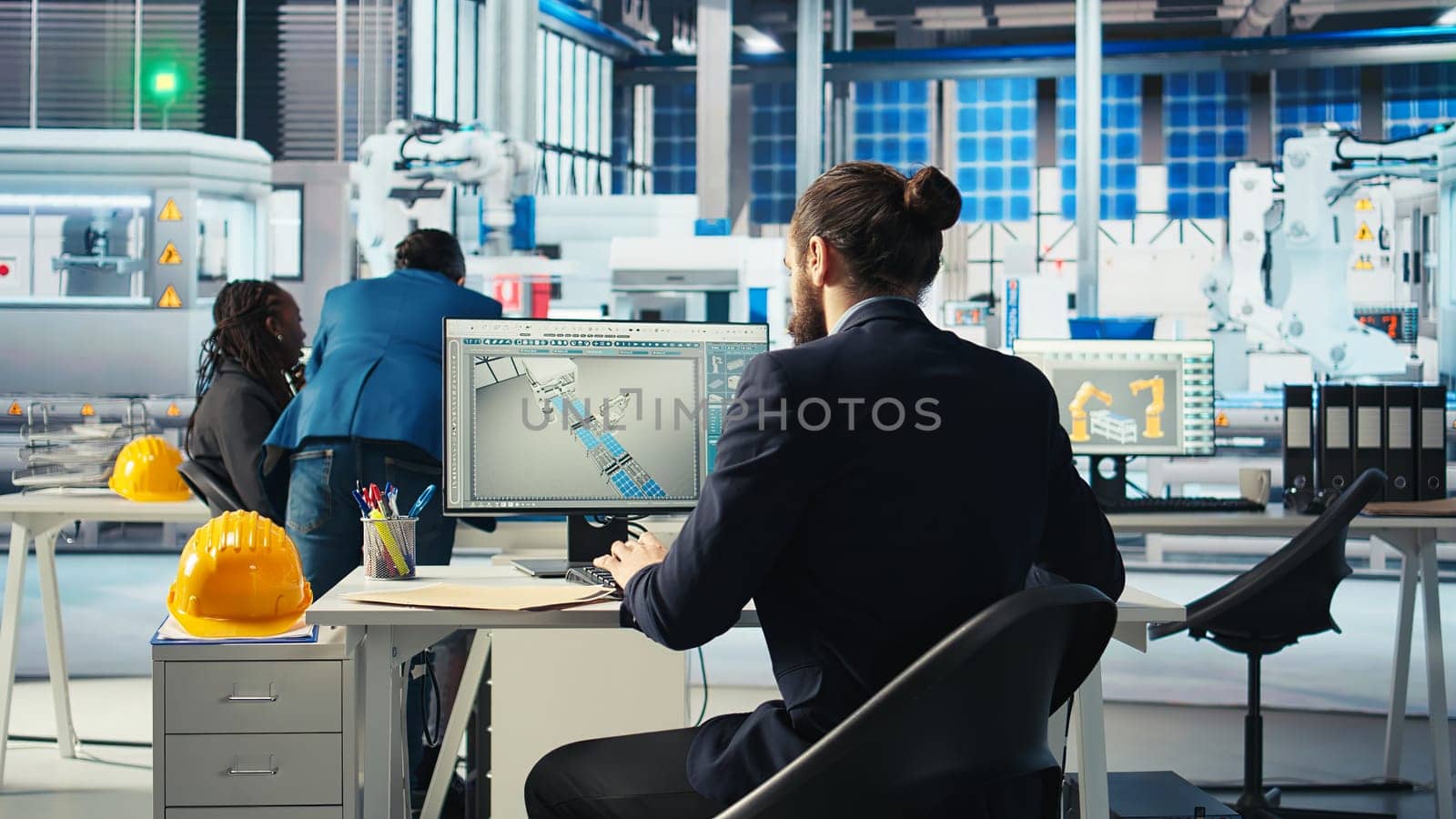 Photovoltaics factory expert looking over specifications on documents to ensure robot arms placing solar panels on assembly lines are running optimal. Specialist reads solar plant machinery paperwork