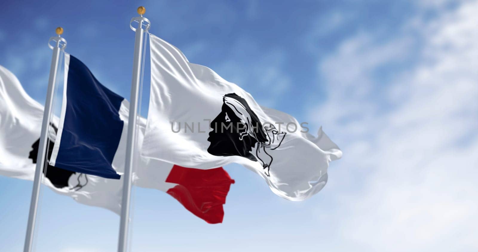 Flags of Corsica waving with national french flag on a clear day. Black Moor head with a white bandana on a white field. French region. 3d illustration render. Rippled fabric. Selective focus