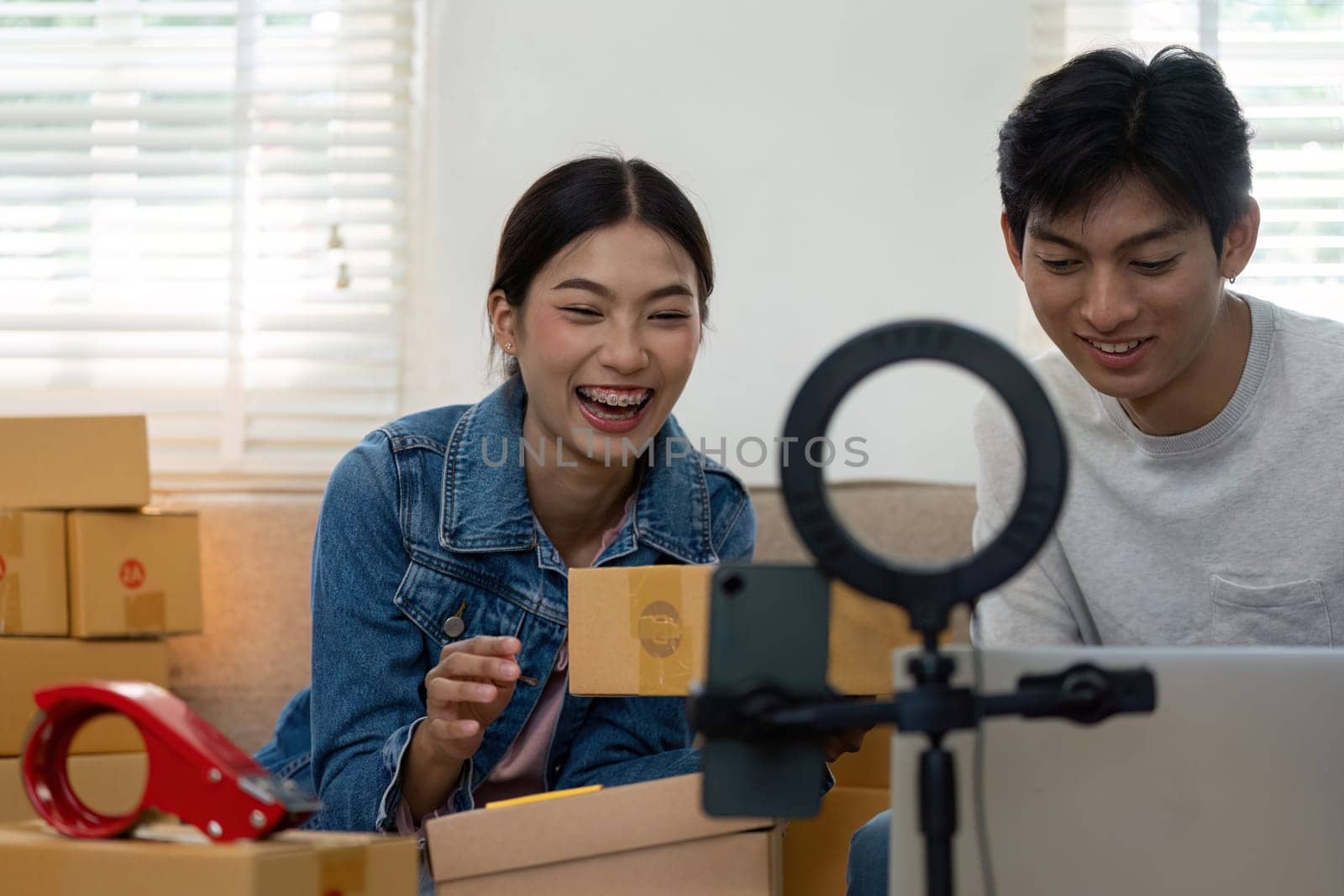 In a vibrant atmosphere, the couple is set to present their products via live streaming, embodying the dynamic spirit of e-commerce and entrepreneurial ventures.