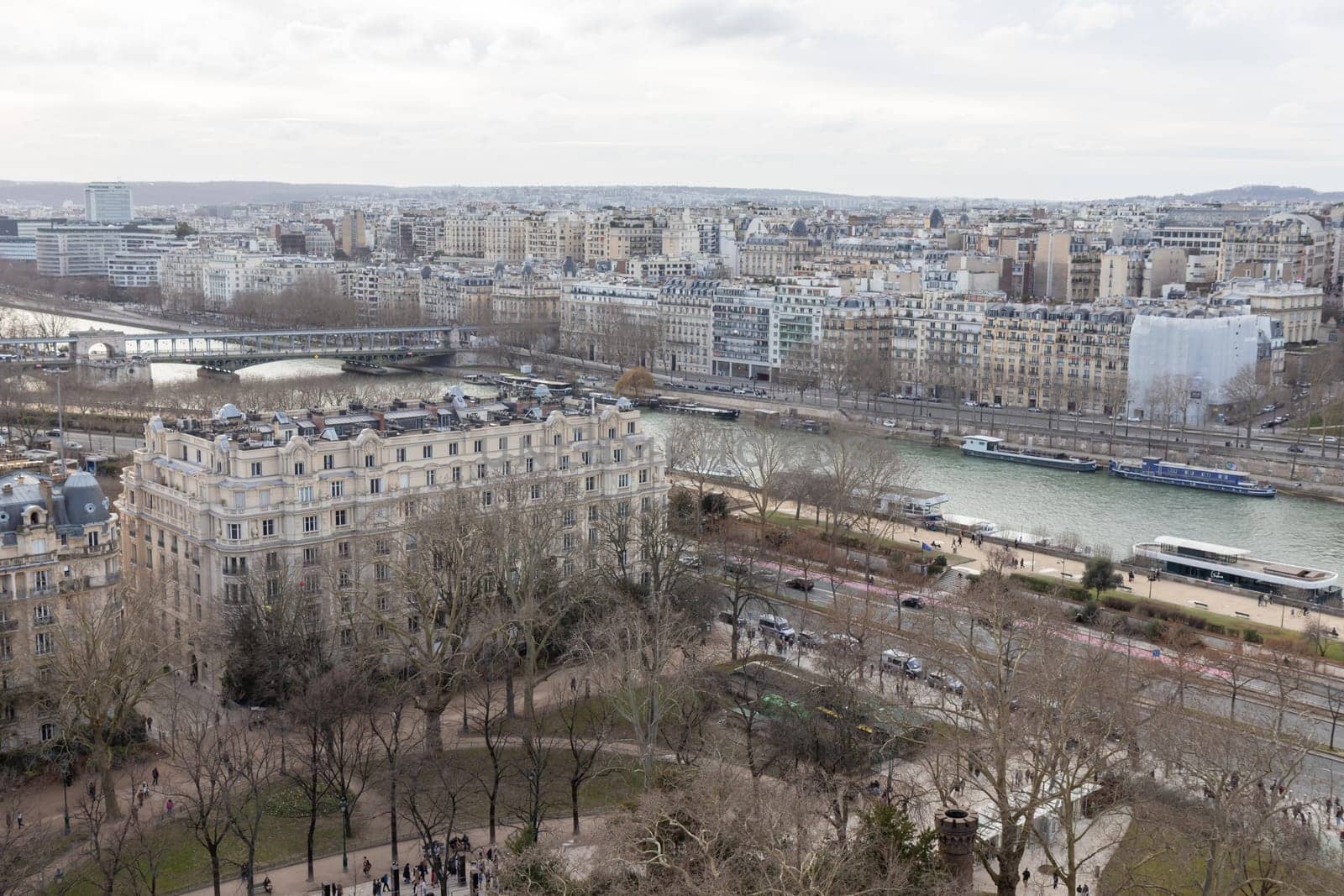Paris city panorama, the aerial view from the Eiffel tower in soft evening light in early spring