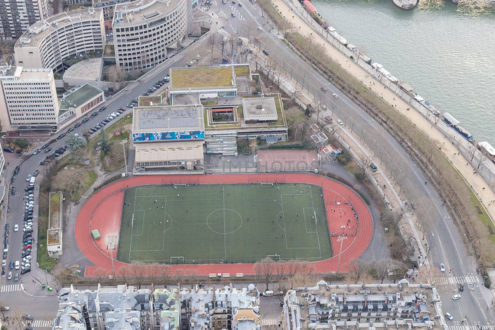 Paris city panorama with Emile Anthoine Stadium, the aerial view from the Eiffel tower in early spring.