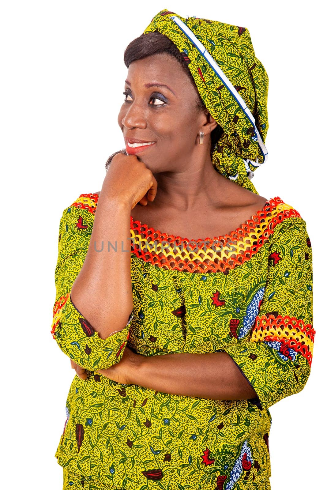 beautiful adult african woman dressed in pensive green loincloth is smiling while touching her chin to one side