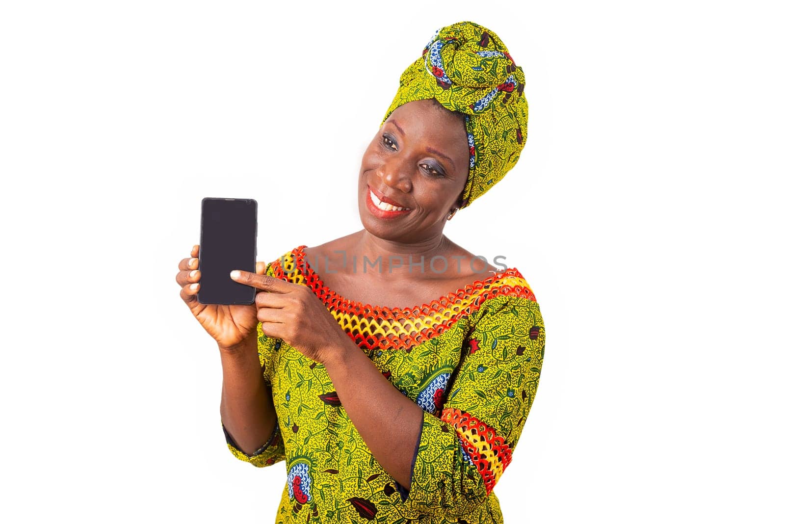 beautiful african adult woman dressed in loincloth and green scarf is happy showing her phone