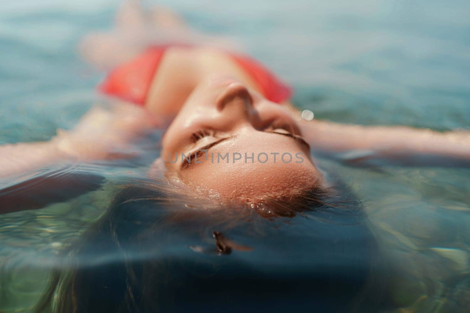 Happy woman sea relaxing floating in transparent sea water on summer holiday. Travel leisure recreation lifestyle, female in nature