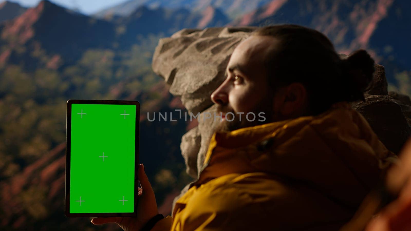 Climber admires breathtaking mountain peak with copy space screen, joyous stance embodies determination, endurance, and the personal fulfillment that comes with overcoming challenges. Camera B.