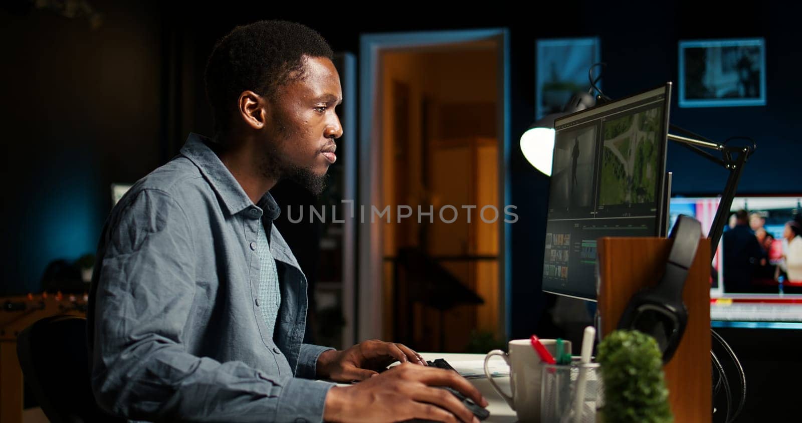Video maker producing montage with artistic software for color adjustment, special effects in movie editing. Digital media illustrator developing transitions for cinematic production. Camera A.