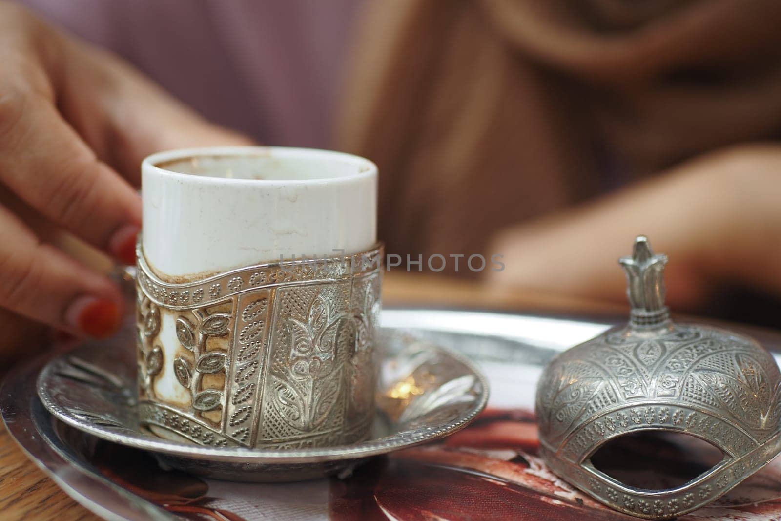 enjoying turkish coffee at cafe ,