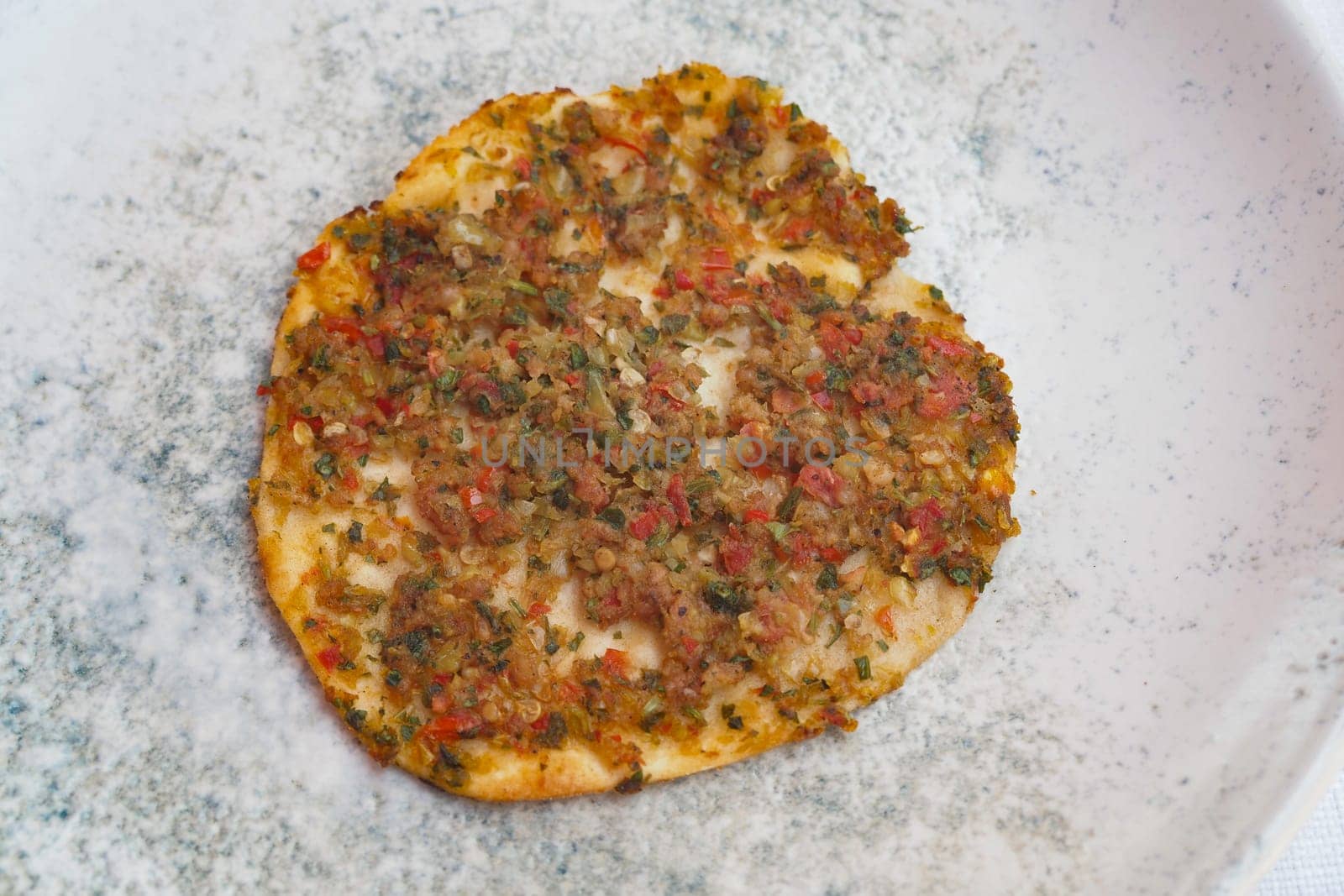 Unique flatbread features a blend of herbs and spices, perfect for tasting.
