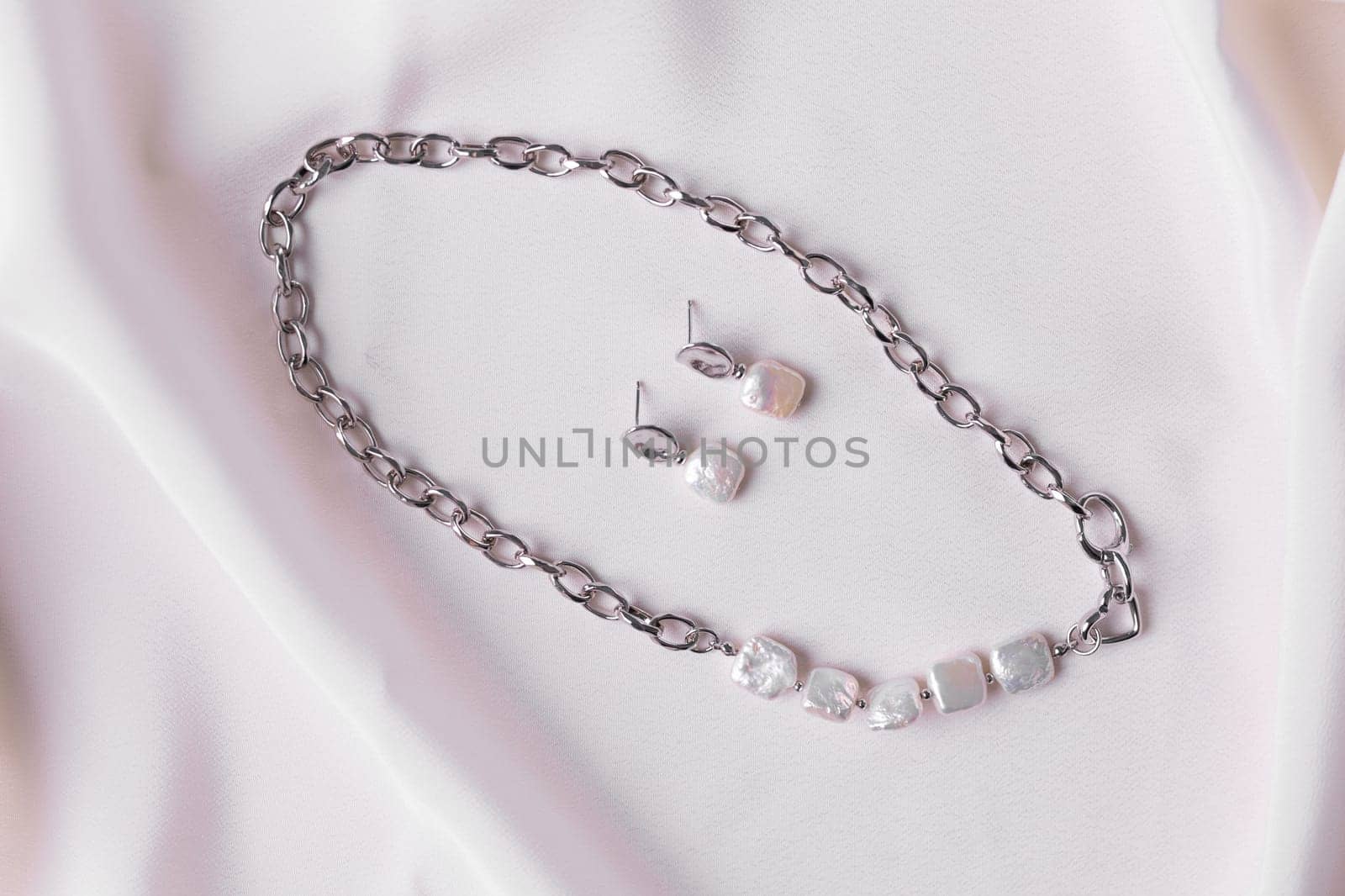 Handmade jewelry on a textile background. Gift for women. Bijouterie and jewellery for women