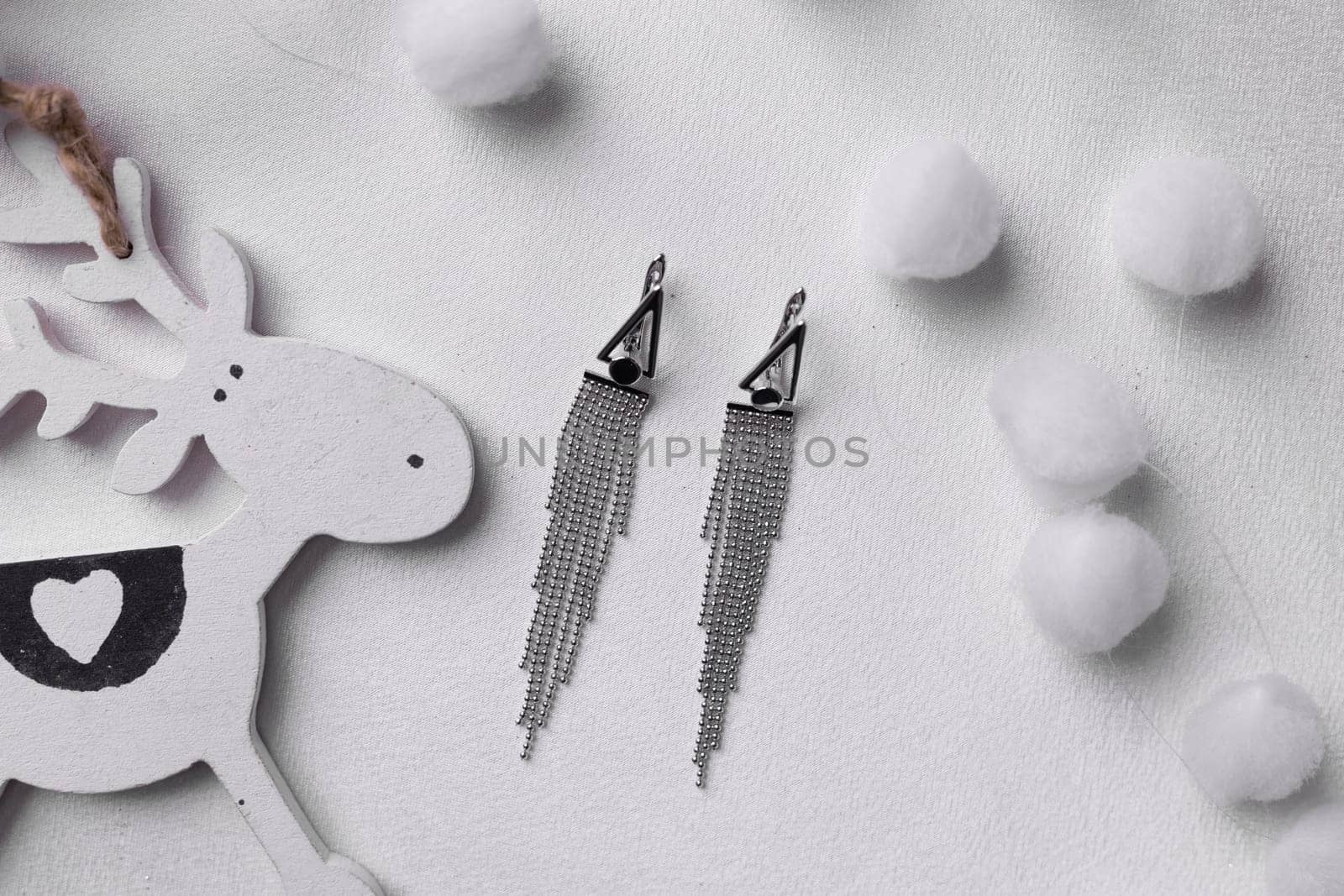 Women's Jewelry. Trendy jewelry on silk background. Flat lay, top view