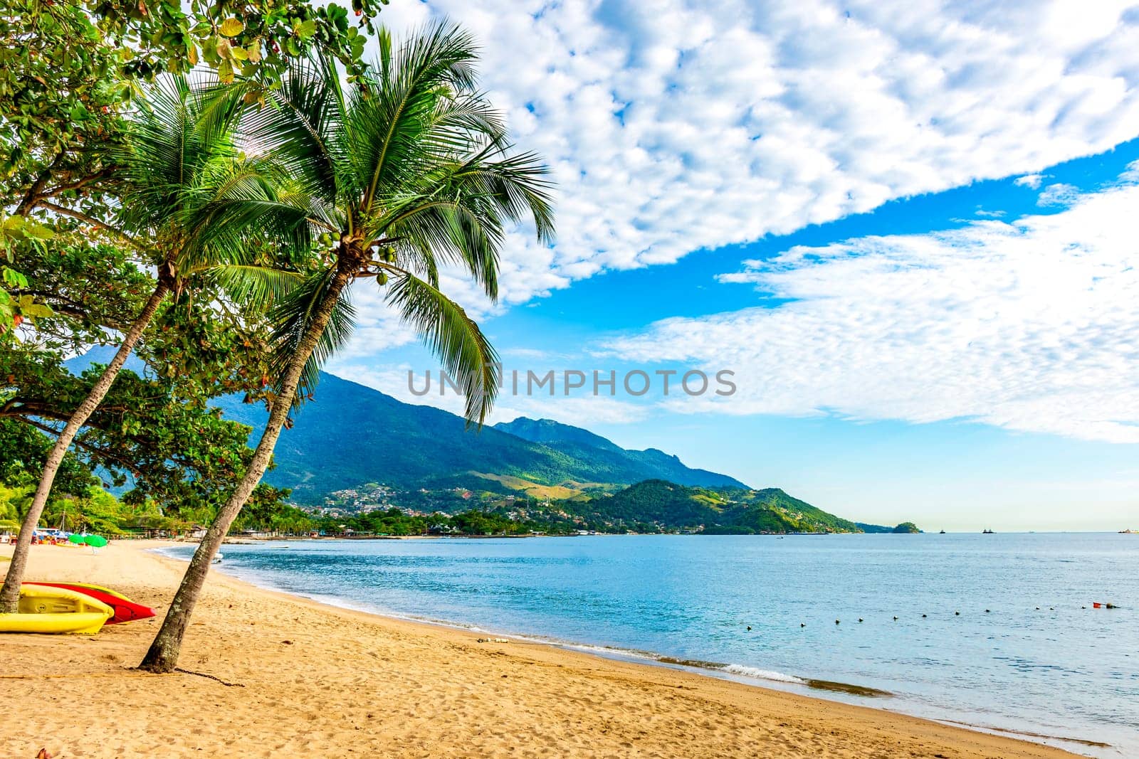 Beach in the urban area of ​​Ilhabela on a summer day