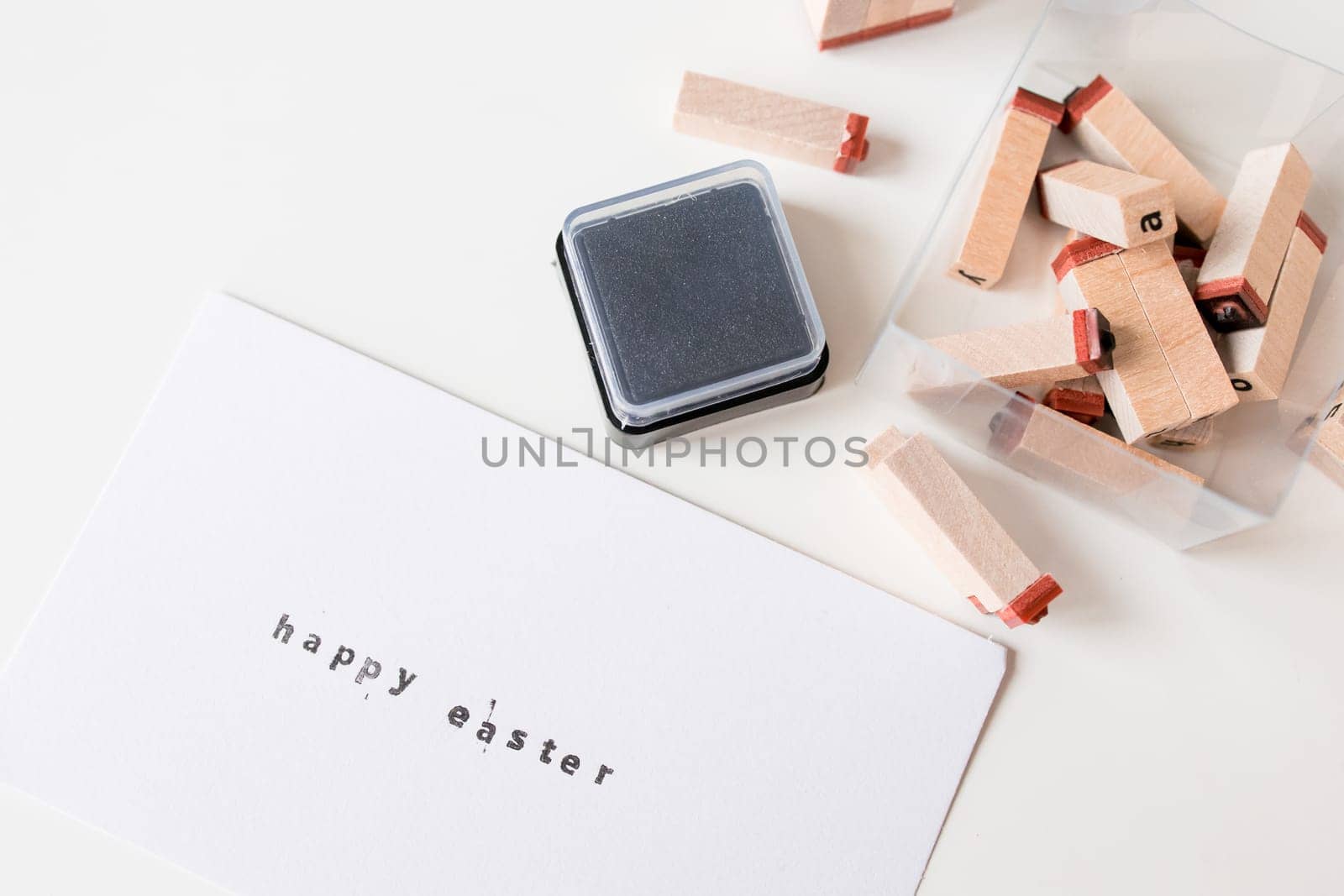 Easter card with rubber stamps and ink pad on white background.