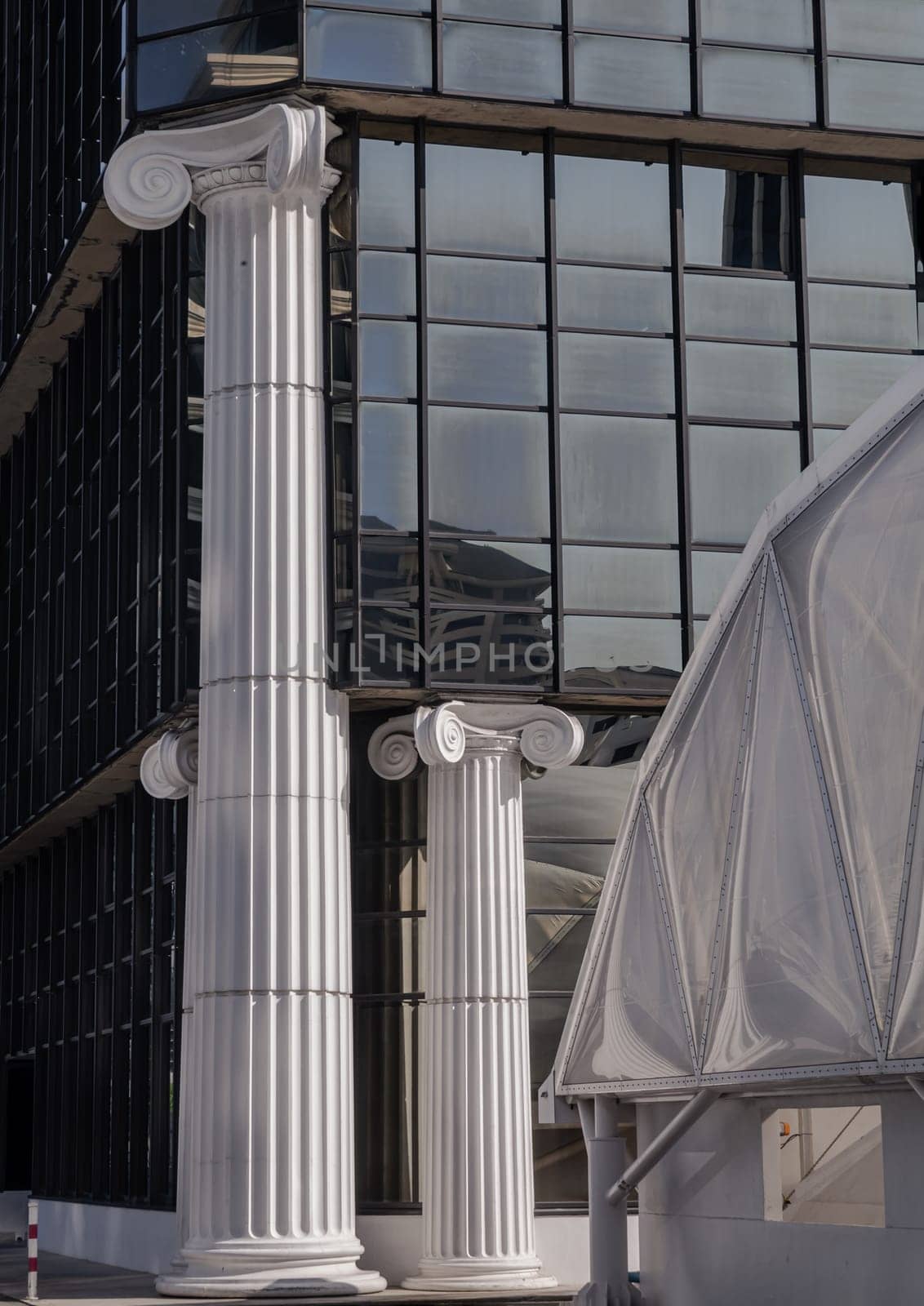 Bangkok, Thailand 23 Dec, 2024 - Architecture element of white columns for decoration building. The morning light shining through Classic pillars detail of Modern building. use it as your Wallpaper, Poster and Copy space, Selective focus.