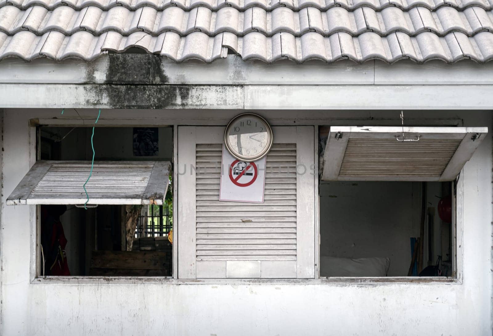 Bangkok, Thailand - 28 Sep, 2024 - Old security guard booth with Weathered and Faded paint (Guardhouse) in public park. Security guard cabin, Security Booth, Space for text, Selective focus.
