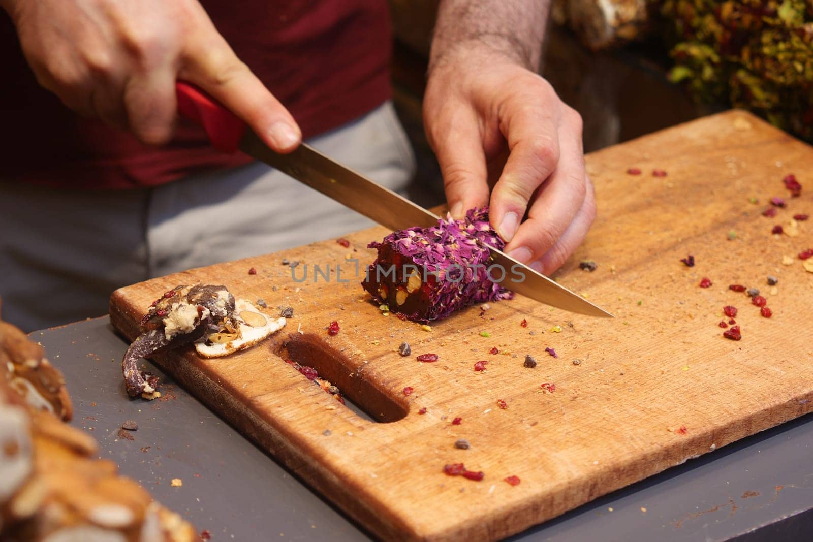 cutting turkish delight on a chopping board ,
