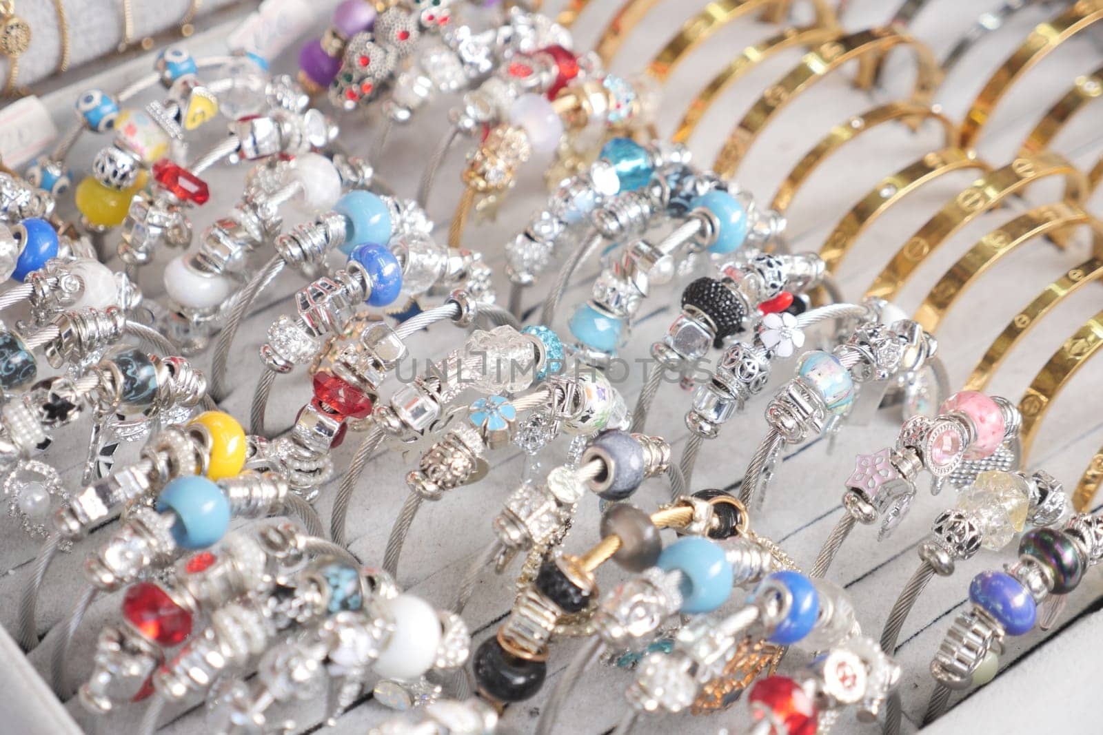 A vibrant assortment of bracelets showcased in an elegant jewelry setting.