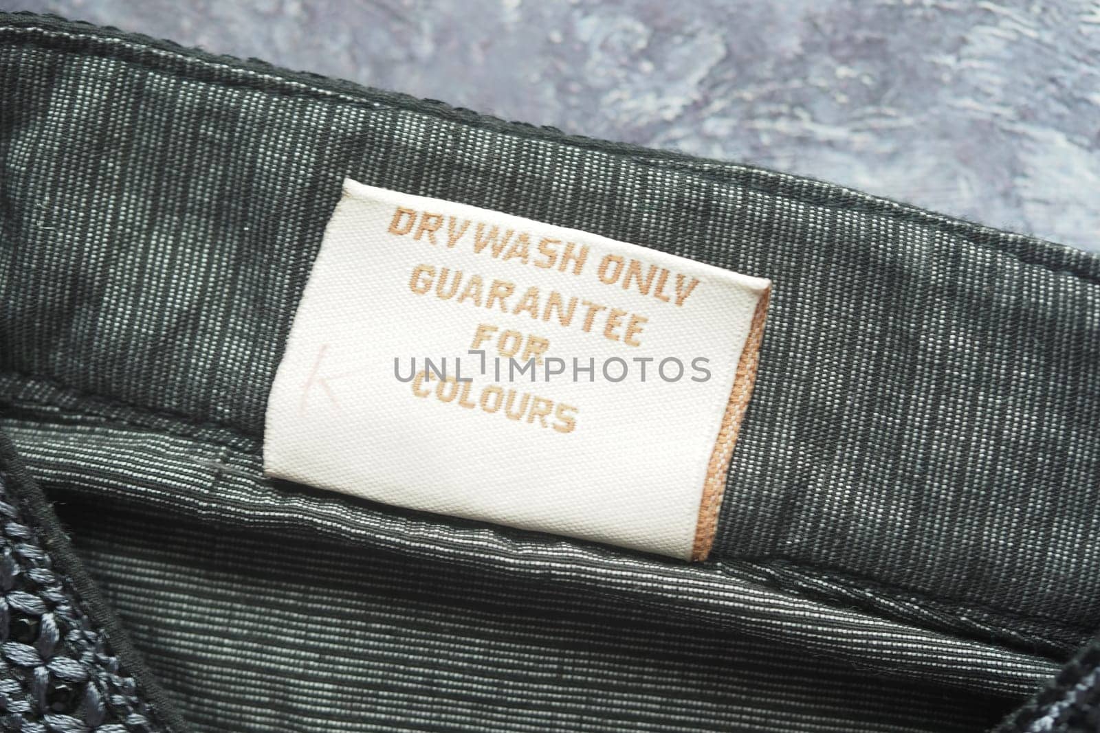 Care label stresses dry wash only to maintain vibrant colors in fabric.