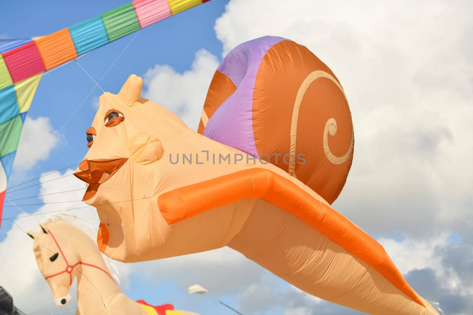 Kite festival. Kite snail in the sky at the beach of Atlantic ocean