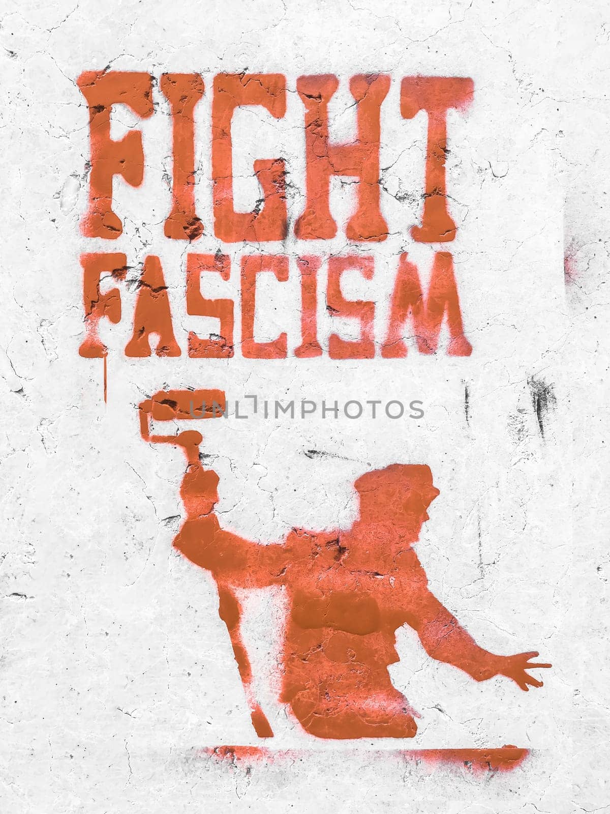 FIGHT FASCISM graphic message on the old wall, anarchist aesthetics. Appeal to boycott fascist intolerance. Support of diversity.