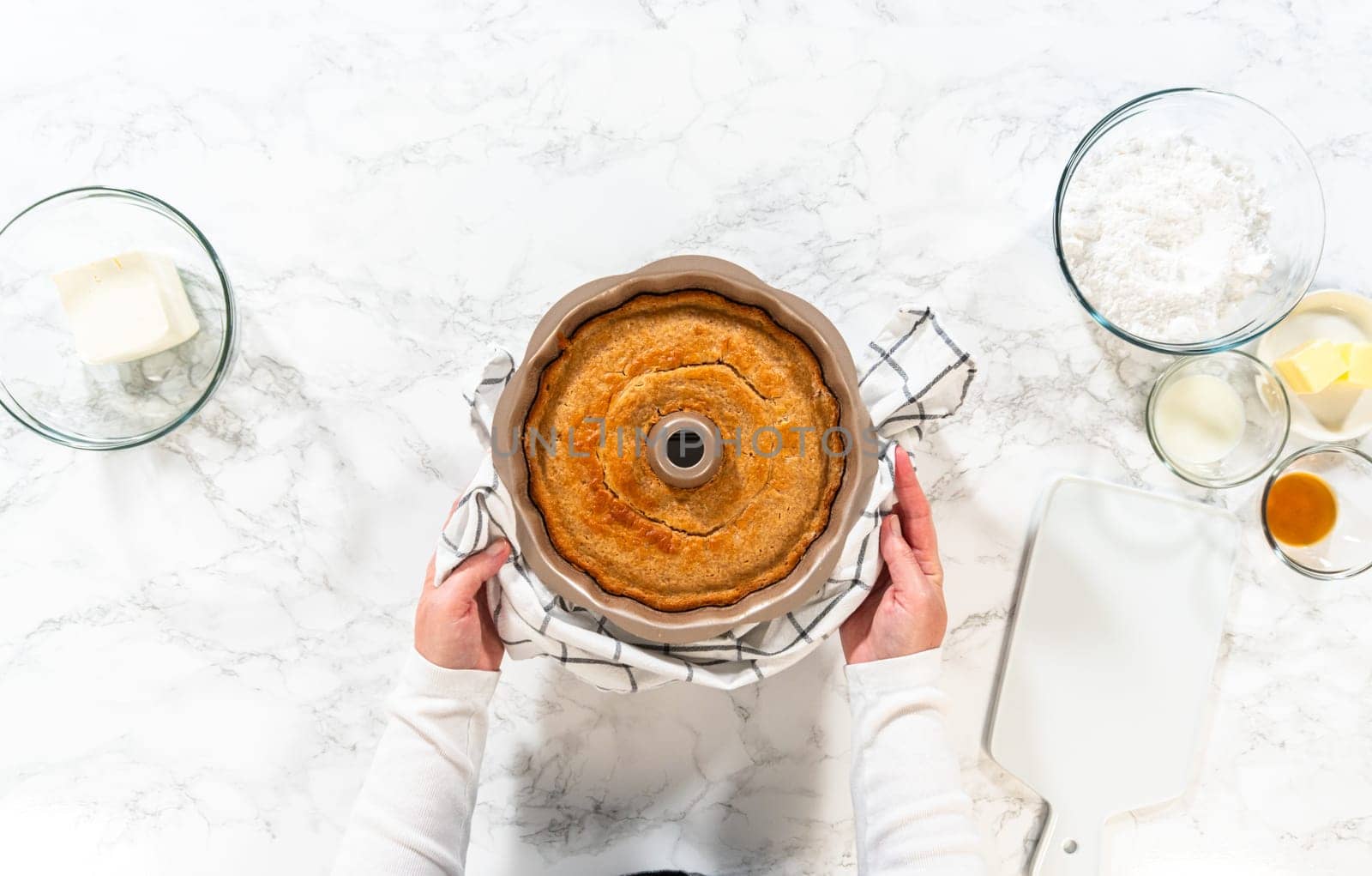 The freshly baked Carrot Bundt Cake is left to cool on the kitchen counter, filling the air with delightful aromas.