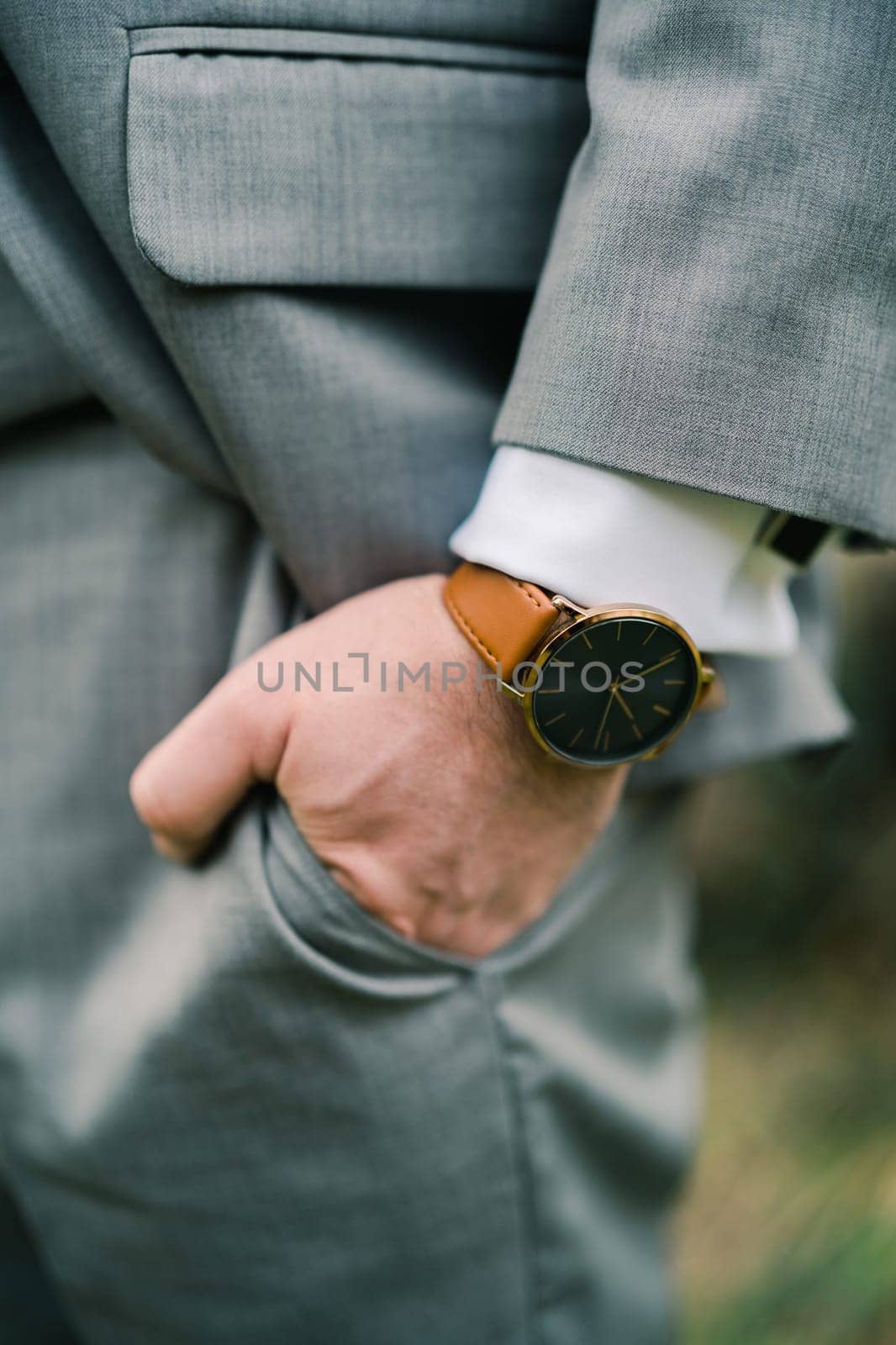 Man with his hand in his pants pocket. Cropped. Faceless. High quality illustration