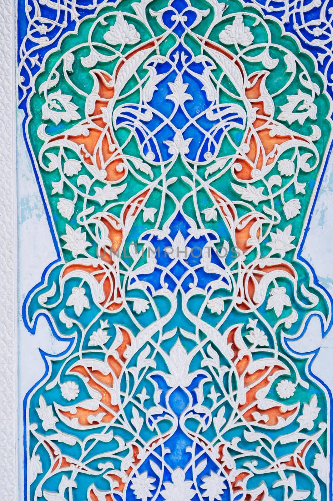 carved wooden painted background in Museum of Art of Uzbekistan with traditional Uzbek ornaments and colorful oriental patterns in Tashkent
