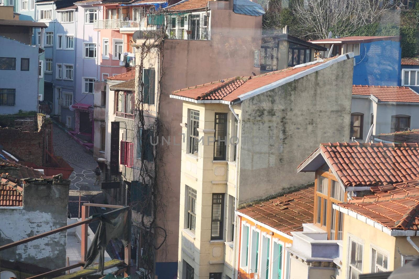 Charming architecture showcases vibrant colors in a narrow urban street.